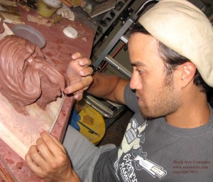 Isaac H. Woofter sculpting in clay