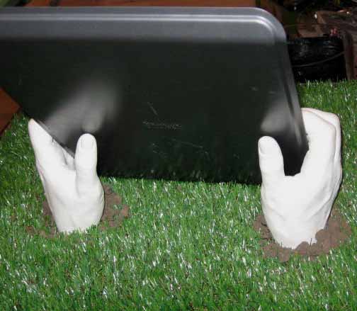 Marina's hands and arms were cast in a negative mold in position holding a cookie sheet. 
