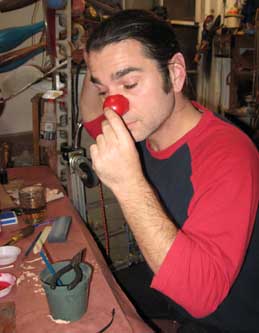Keith trying on his painted leather clown nose